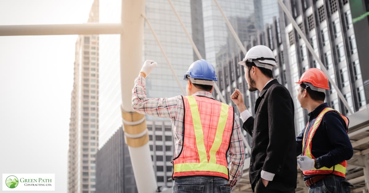 The construction team building a laneway house looking at the map of the structure