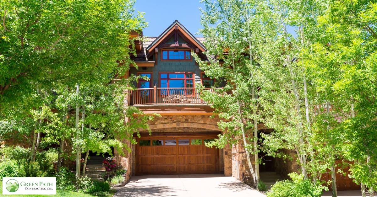 A laneway house surrounded by trees.